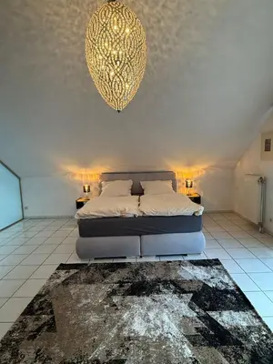 Ein Bett oder Betten in einem Zimmer der Unterkunft Viktoria`s Penthouse