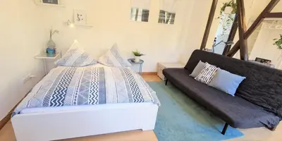 Ein Bett oder Betten in einem Zimmer der Unterkunft FachwerkNest Koblenz I10 Min zur Altstadt I 400 Mbit WLAN I Parkplatz