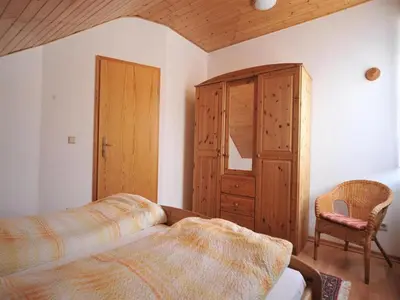 Ein Bett oder Betten in einem Zimmer der Unterkunft Ferienweingut Hammes