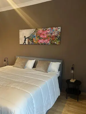 Ein Bett oder Betten in einem Zimmer der Unterkunft Urban Premium - City-Suite am Park für 2 Pers