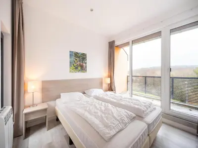 Ein Bett oder Betten in einem Zimmer der Unterkunft Family home in Hambachtal Boutique Resort