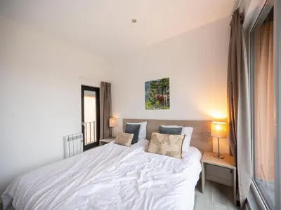 Ein Bett oder Betten in einem Zimmer der Unterkunft Hambachtal forest hideaway boutique resort