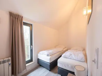 Ein Bett oder Betten in einem Zimmer der Unterkunft Spacious holiday home in Hambachtal Resort