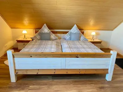Ein Bett oder Betten in einem Zimmer der Unterkunft Zwei stilvolle Gästezimmer mit exklusivem Bad