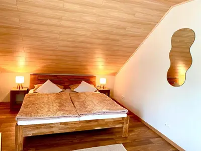Ein Bett oder Betten in einem Zimmer der Unterkunft Zwei stilvolle Gästezimmer mit exklusivem Bad
