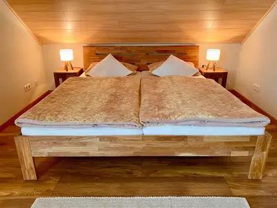 Ein Bett oder Betten in einem Zimmer der Unterkunft Zwei stilvolle Gästezimmer mit exklusivem Bad