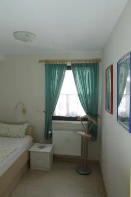 Ein Bett oder Betten in einem Zimmer der Unterkunft Pension Schiffer
