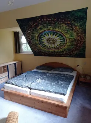 Ein Bett oder Betten in einem Zimmer der Unterkunft Doppelzimmer mit Gartenblick