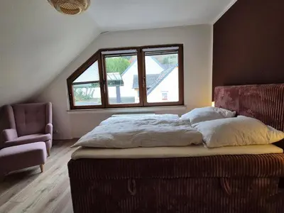 Ein Bett oder Betten in einem Zimmer der Unterkunft Ferienwohnung Lucia in Rech
