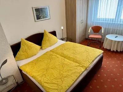 Ein Bett oder Betten in einem Zimmer der Unterkunft Haus Edeltrud - Ferienwohnung Moselblick