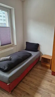 Ein Bett oder Betten in einem Zimmer der Unterkunft I Schöne Wohnung in Bingen mit phantastischem Blick auf die Nahe Fewo für Monteure-A