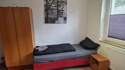 Ein Bett oder Betten in einem Zimmer der Unterkunft I Schöne Wohnung in Bingen mit phantastischem Blick auf die Nahe Fewo für Monteure-A
