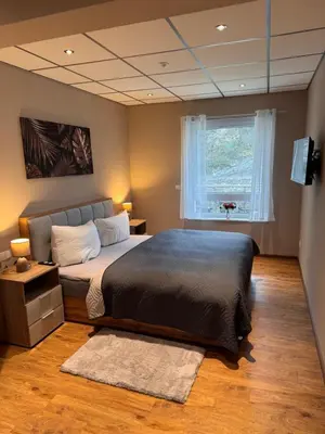 Ein Bett oder Betten in einem Zimmer der Unterkunft Ferienwohnung im Saloon Altenahr