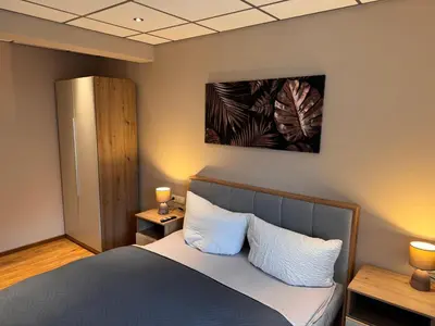Ein Bett oder Betten in einem Zimmer der Unterkunft Ferienwohnung im Saloon Altenahr