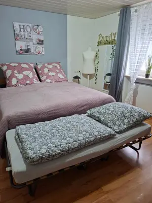 Ein Bett oder Betten in einem Zimmer der Unterkunft Ferienwohnung Seeblick
