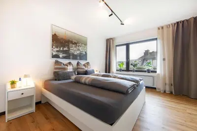 Ein Bett oder Betten in einem Zimmer der Unterkunft Burgberg City Apartment