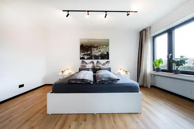 Ein Bett oder Betten in einem Zimmer der Unterkunft Burgberg City Apartment