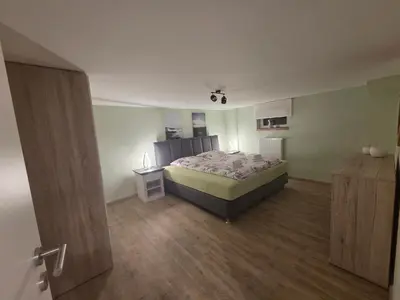 Ein Bett oder Betten in einem Zimmer der Unterkunft Ferienwohnung Mondstube
