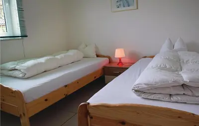 Ein Bett oder Betten in einem Zimmer der Unterkunft Nice Home In Gerolsteinhinterhausen