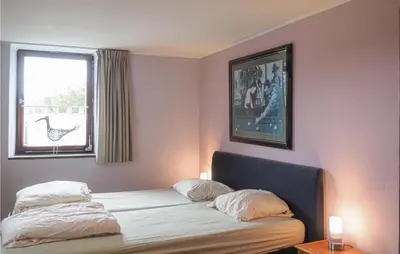 Ein Bett oder Betten in einem Zimmer der Unterkunft Nice Home In Lünebach With Kitchen