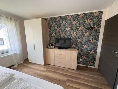 Ein Bett oder Betten in einem Zimmer der Unterkunft Gästehaus Eifelzauber