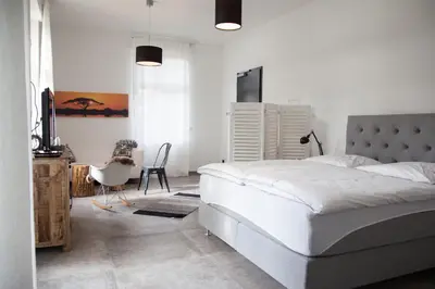 Ein Bett oder Betten in einem Zimmer der Unterkunft Guesthouse Altes Rathaus