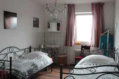 Ein Bett oder Betten in einem Zimmer der Unterkunft Pension Rodenburg