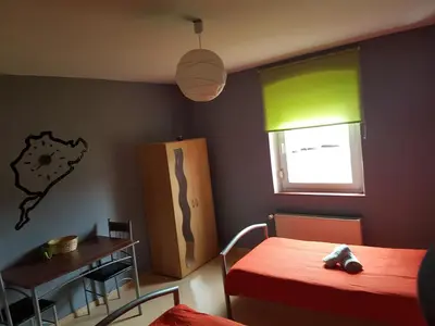 Ein Bett oder Betten in einem Zimmer der Unterkunft Ring-Speed Motorsport