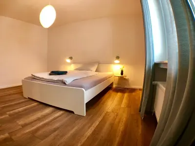 Ein Bett oder Betten in einem Zimmer der Unterkunft Auszeit-Eifel Appartements