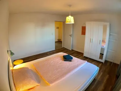 Ein Bett oder Betten in einem Zimmer der Unterkunft Auszeit-Eifel Appartements