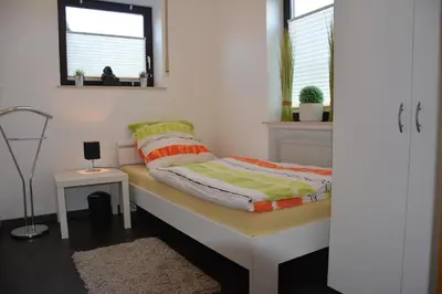Ein Bett oder Betten in einem Zimmer der Unterkunft Ferienwohnung Hedi