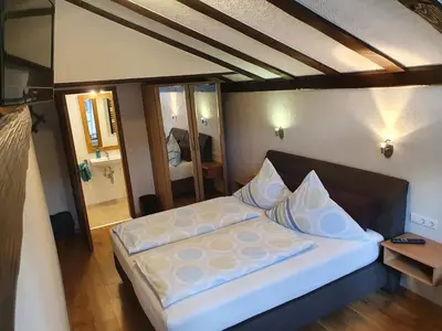 Ein Bett oder Betten in einem Zimmer der Unterkunft Ferienweingut Stein