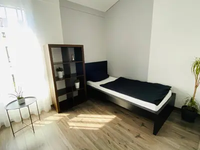 Ein Bett oder Betten in einem Zimmer der Unterkunft Ferienhaus Alte Kaserne