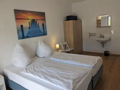 Ein Bett oder Betten in einem Zimmer der Unterkunft Ferienanlage - Am Moselufer