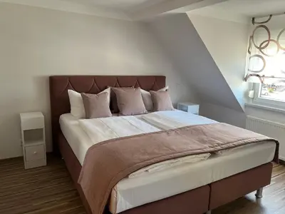 Ein Bett oder Betten in einem Zimmer der Unterkunft Hochwald Lodge