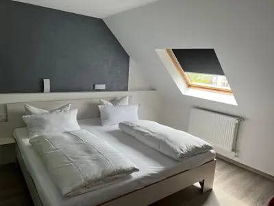 Ein Bett oder Betten in einem Zimmer der Unterkunft Hochwald Lodge