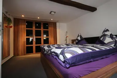 Ein Bett oder Betten in einem Zimmer der Unterkunft Ferienhaus DaVinci