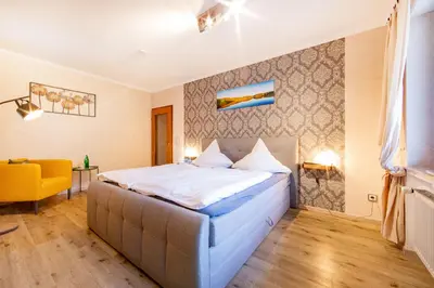 Ein Bett oder Betten in einem Zimmer der Unterkunft Landgasthaus Zum Kreuzberg
