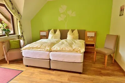 Ein Bett oder Betten in einem Zimmer der Unterkunft Baunhöller-Mühle