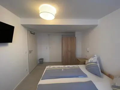 Ein Bett oder Betten in einem Zimmer der Unterkunft Privatzimmer Hoffmann