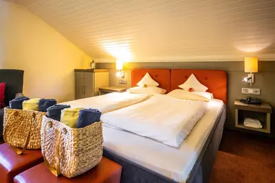 Ein Bett oder Betten in einem Zimmer der Unterkunft Menschels Vitalresort
