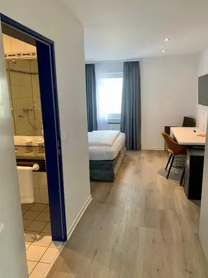 Ein Bett oder Betten in einem Zimmer der Unterkunft Hotel Wittlicher Hof