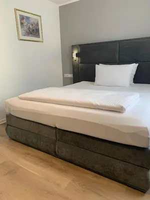 Ein Bett oder Betten in einem Zimmer der Unterkunft Hotel Wittlicher Hof