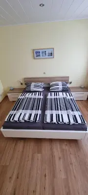 Ein Bett oder Betten in einem Zimmer der Unterkunft Ferienwohnung Jo Secco