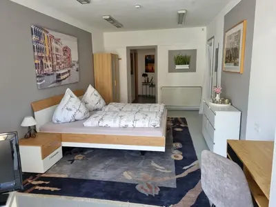 Ein Bett oder Betten in einem Zimmer der Unterkunft Ferienwohnung Eigner