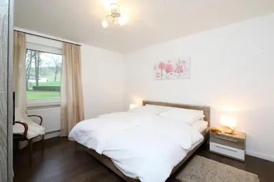 Ein Bett oder Betten in einem Zimmer der Unterkunft Ferienwohnungen Grafenfelder Hof