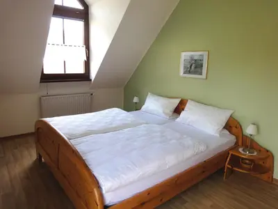 Ein Bett oder Betten in einem Zimmer der Unterkunft Ferienwohnung am Moselufer
