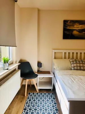 Ein Bett oder Betten in einem Zimmer der Unterkunft Der Stammbaum ORIGIN STAY