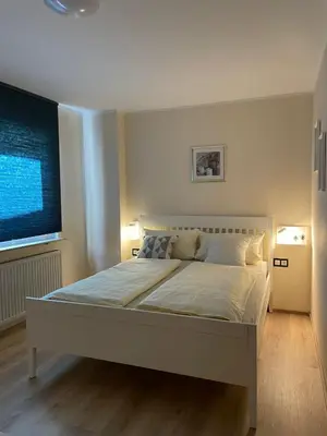 Ein Bett oder Betten in einem Zimmer der Unterkunft Der Stammbaum ORIGIN STAY
