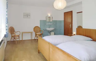Ein Bett oder Betten in einem Zimmer der Unterkunft Cozy Apartment In Gerolstein-Müllenborn